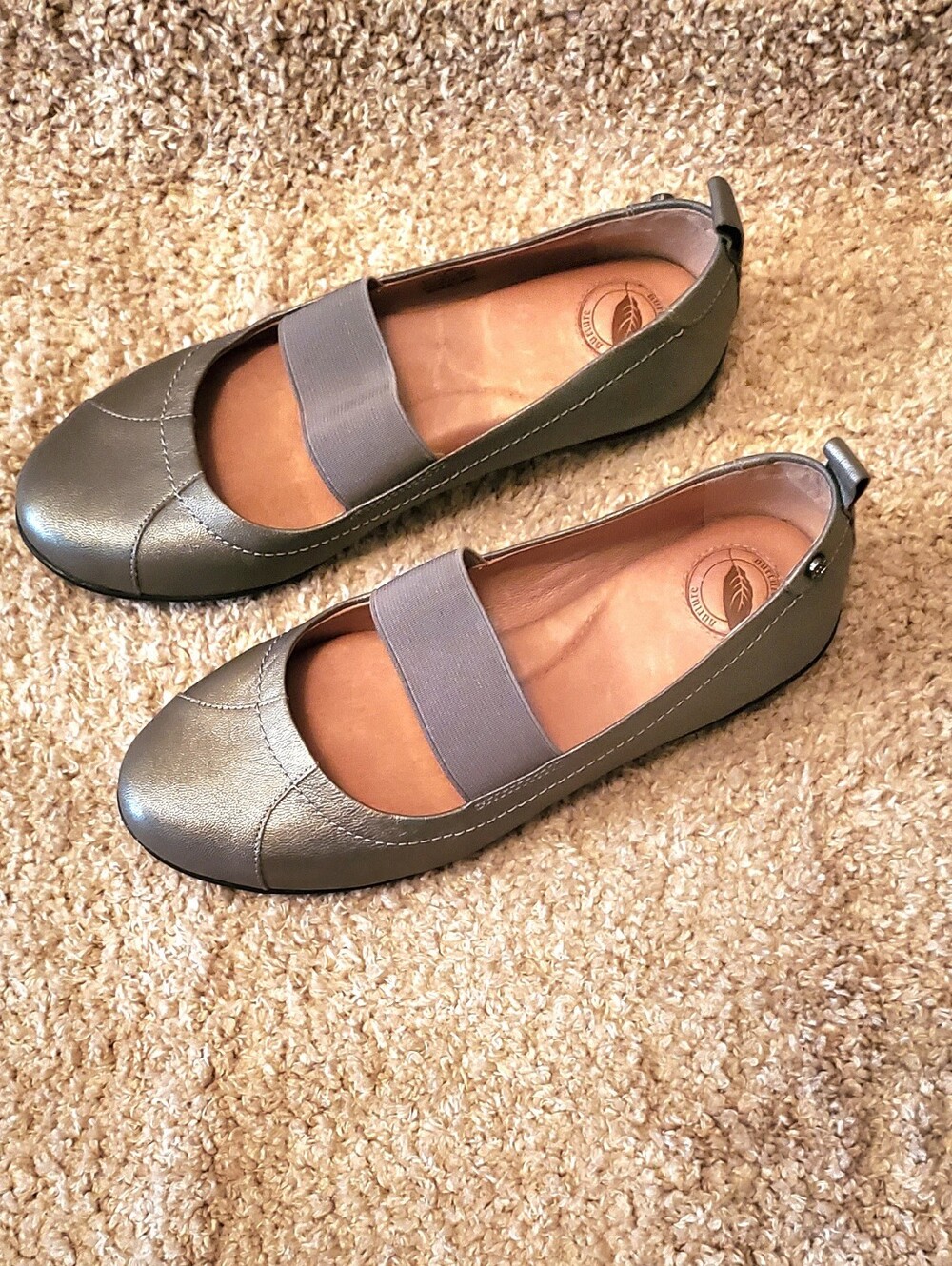 Nuture By Lamaze Mary Jane Flats in Champagne Gold with Elastic Strap.